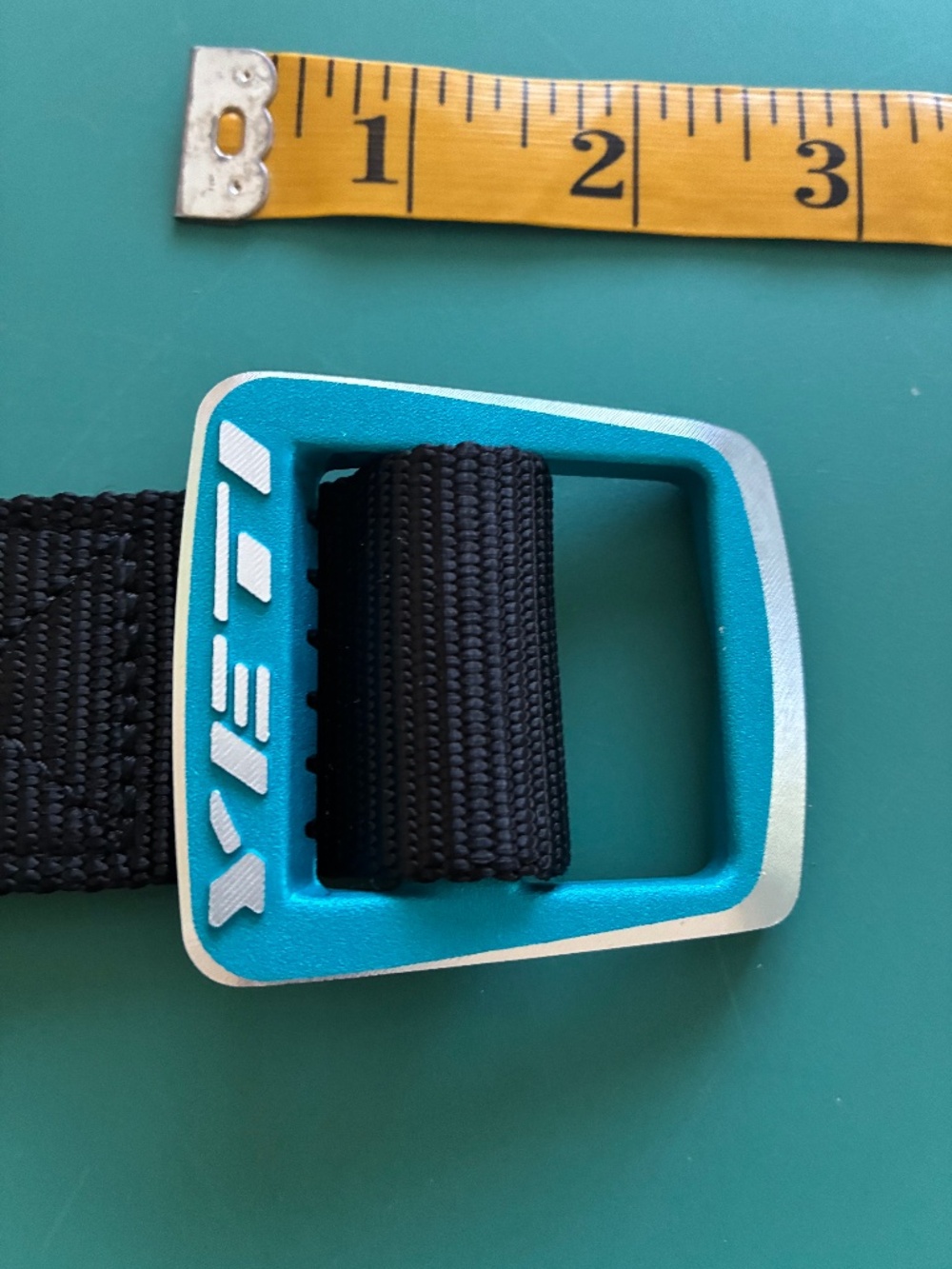 Yeti Bicycles Belt Buckle and Bottle Opener with Black Webbed Belt